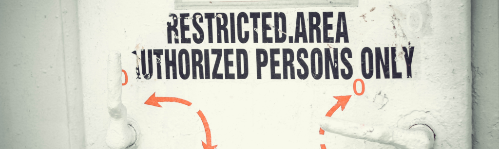 Protect Your Business: 4 Things A Business Attorney Wants You to Know if ICE Arrives at Your Business 1 Image of a door showing the words restricted area, authorized persons only